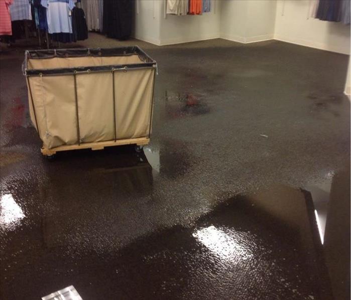 Floor of clothing store covered in water