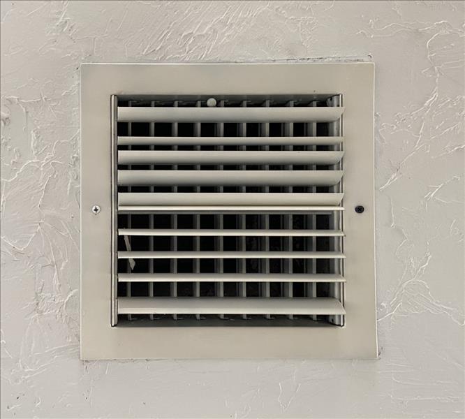 Clean white air conditioning vent.