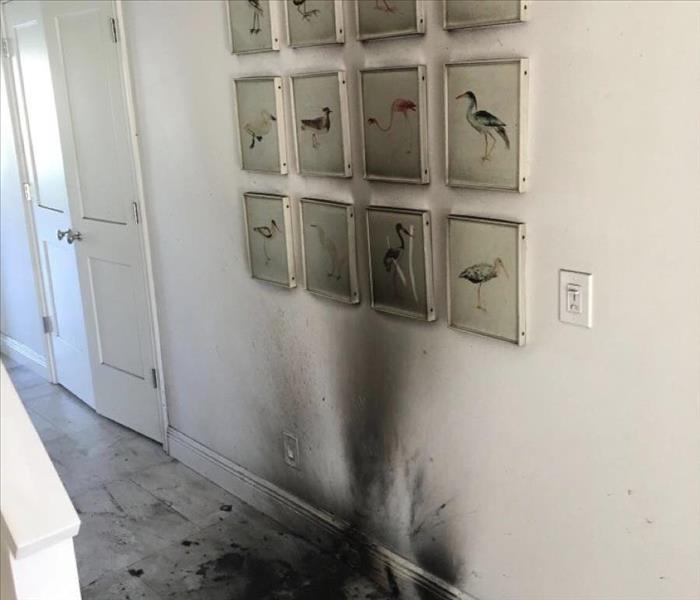 Wall in home covered by black soot 