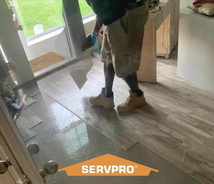 SERVPRO technician working on home from water damage