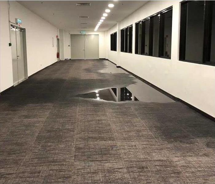 water damage on floor of commercial building