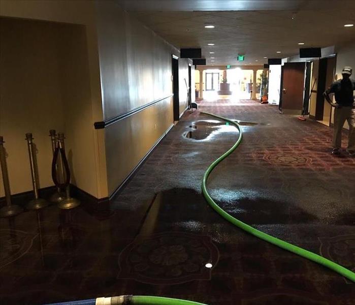 Movie theater walkway with water saturated carpets