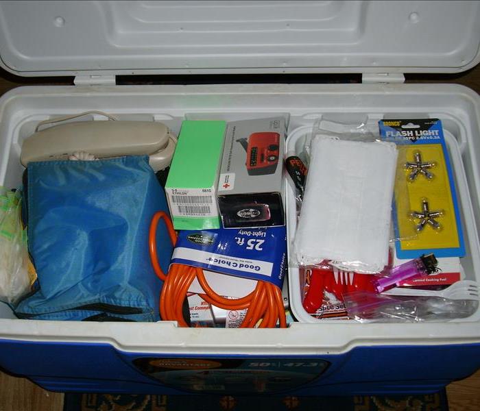 Cooler packed with hurricane survival supplies. 