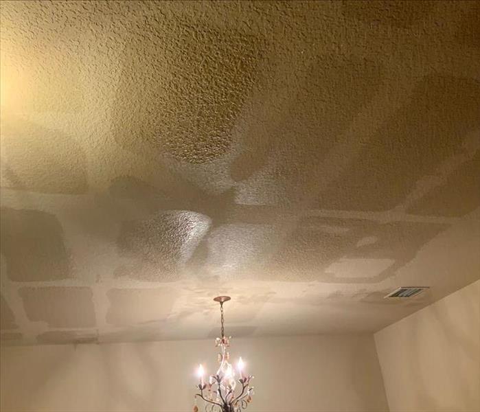 Ceiling with water stains from a water loss on the second floor. 